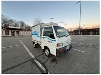 a white truck with a sold sign on it