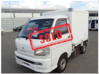 a white truck with a sold sign on it