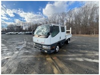 a white truck with a sold sign on it