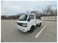 a white truck with a sold sign on it