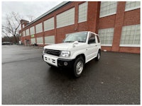 a white truck with a sold sign on it