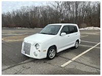 a white truck with a sold sign on it