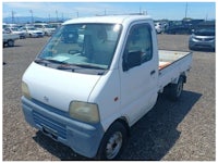 a white truck with a sold sign on it