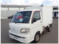 a white truck with a sold sign on it