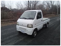 a white truck with a sold sign on it