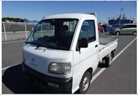 a white truck with a sold sign on it